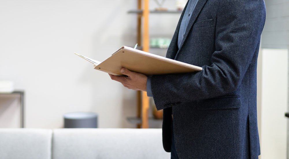 Inspection guy holding a notebook