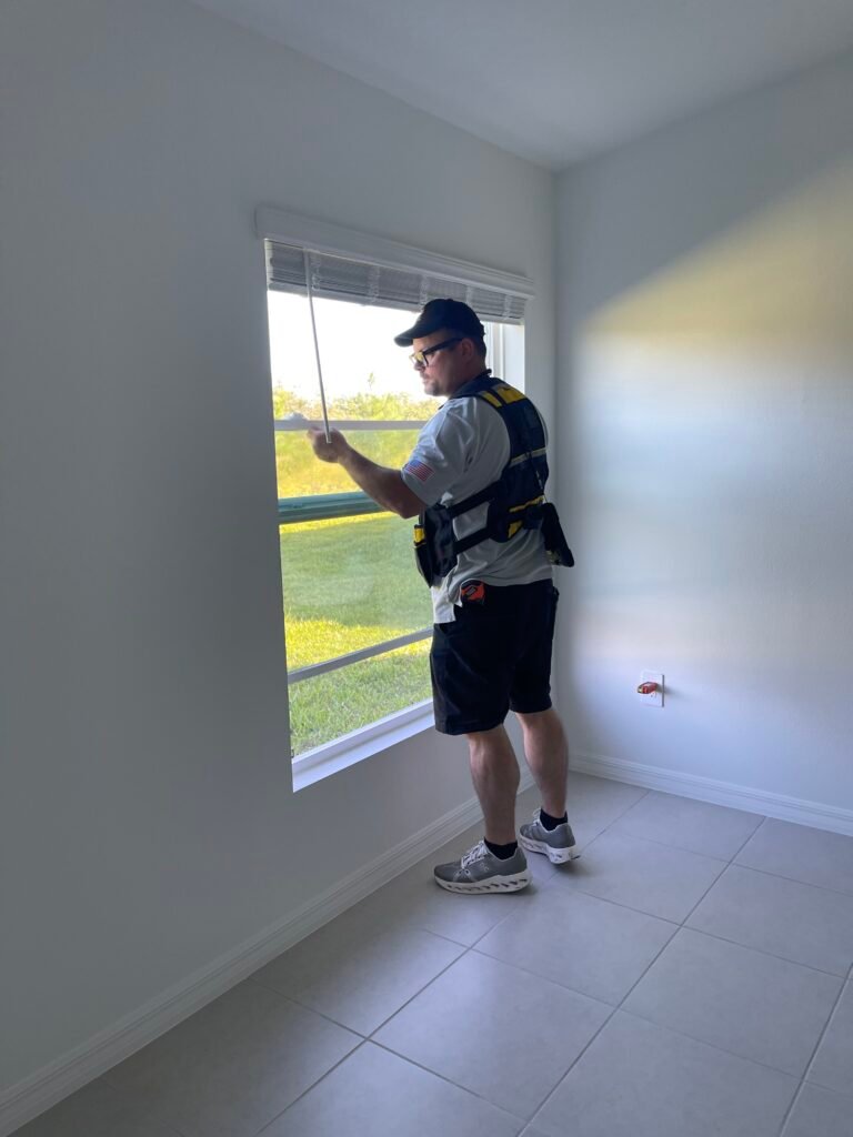 Rob from apex sights solutions doing a professional home inspection and inspeting a window in a house