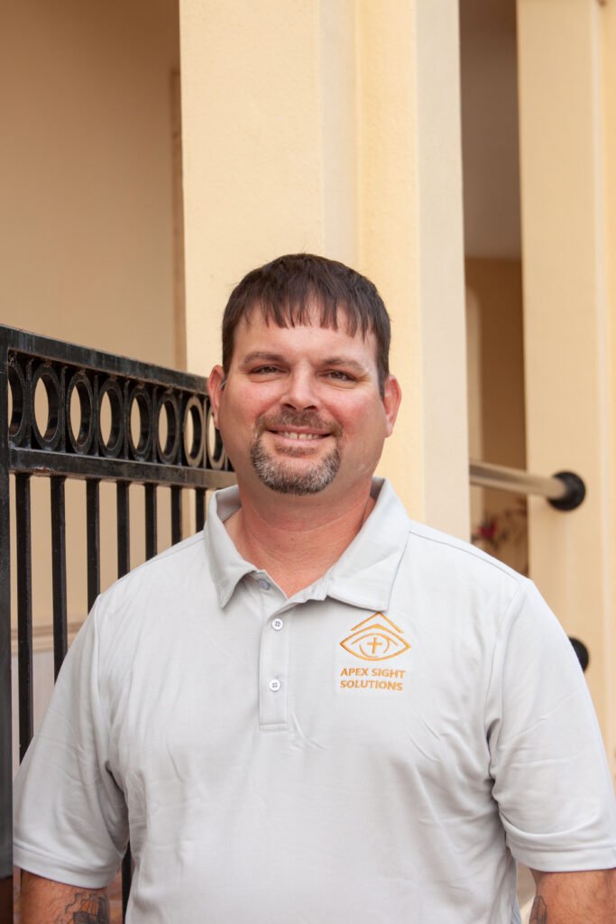 Rob smiling for a professional headshot for apex sight solutions